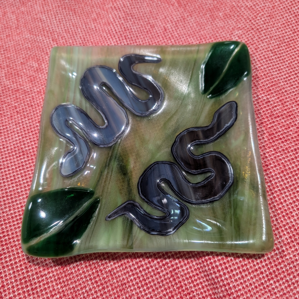 Green and Black Reptile Dish